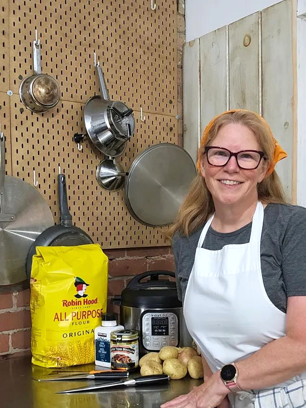 Lesley Taylor in her kitchen with baking supplies